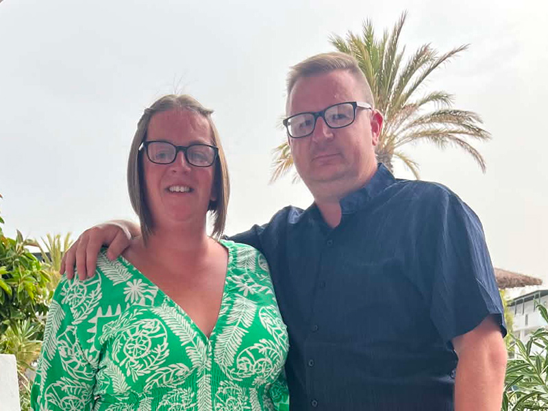 A man and a woman standing close to each other